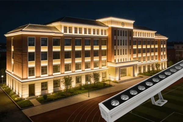 A durable outdoor LED wall washer light illuminating a modern building facade
