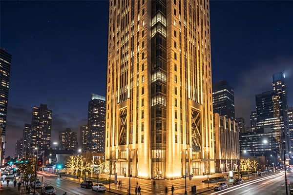 A powerful wall washer light successfully illuminating a tall building facade