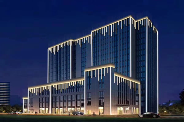 Facade of a modern office building lit with 4000K light