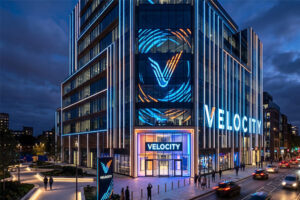 A building facade with lighting that reflects its brand identity