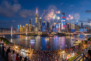 A city skyline lit up for a national celebration