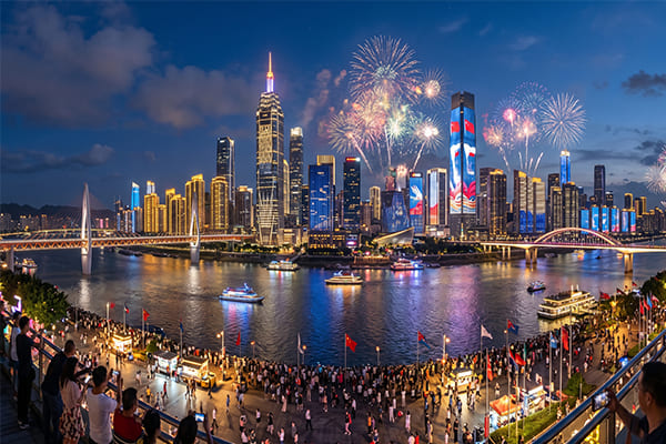 A city skyline lit up for a national celebration